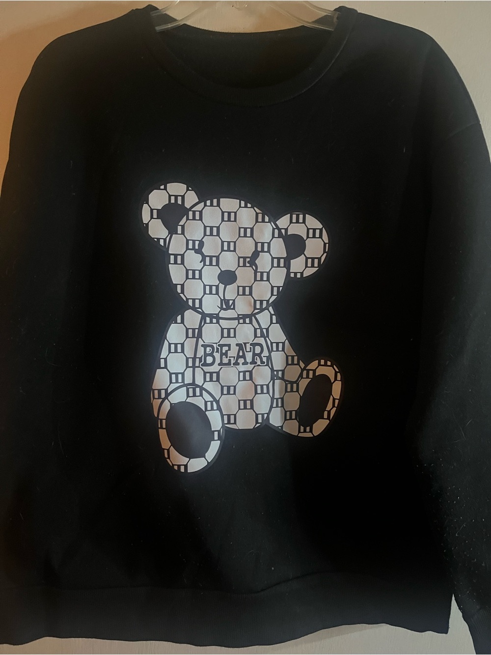 Black Sweatshirt with Patterned Bear Graphic
